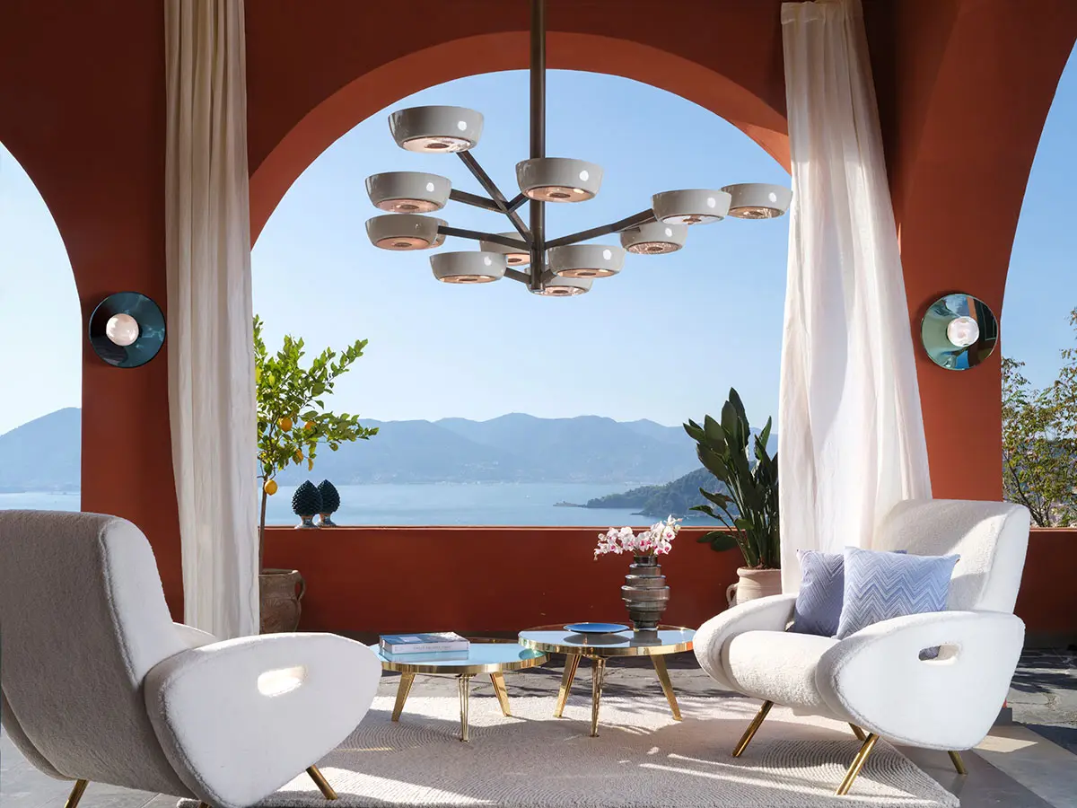 A composition of Gaspare Asaro Riflesso and Fiore tables in a Mediterranean villa.