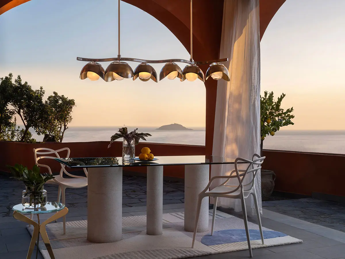 The Gaspare Asaro Serpente ceiling light at sunset overlooking the island of Palmaria, in Liguria, Italy.
