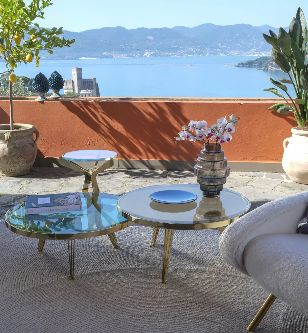A composition of Riflesso and Fiore tables in a Mediterranean villa.